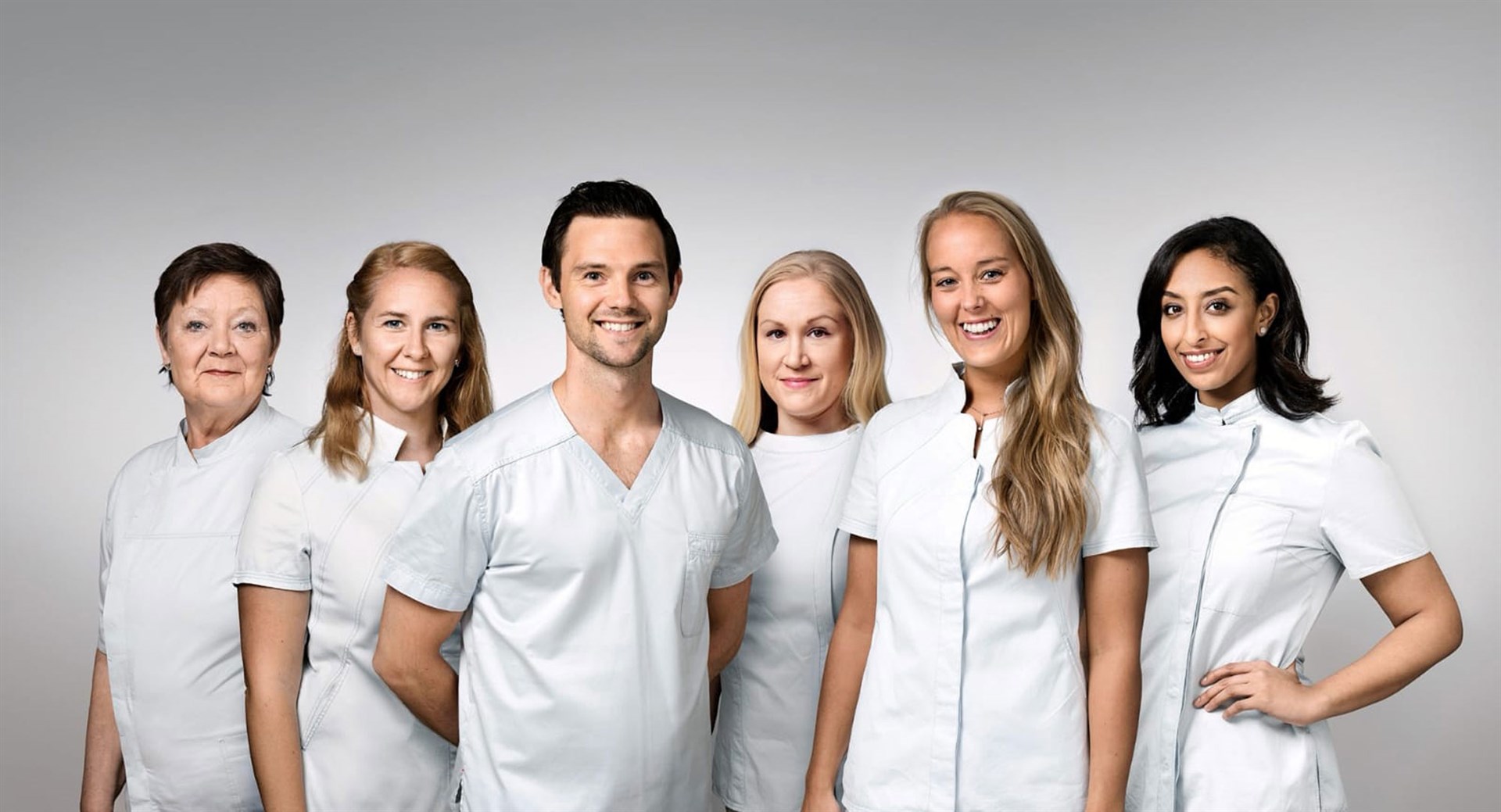 Galleriatandläkarnas tandläkare i en gruppbild